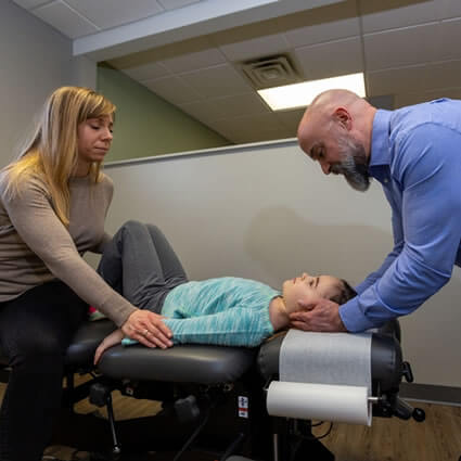 Dr. Prinkey adjusting child