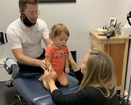 Toddler on adjusting table