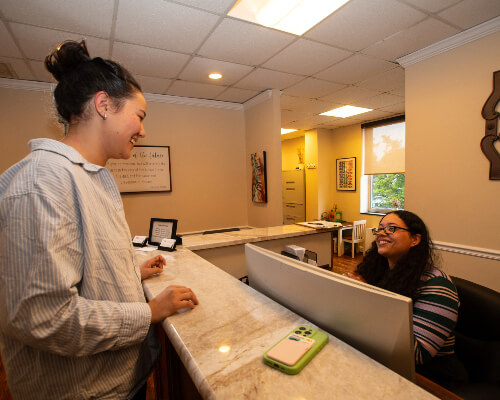 patient at reception desk