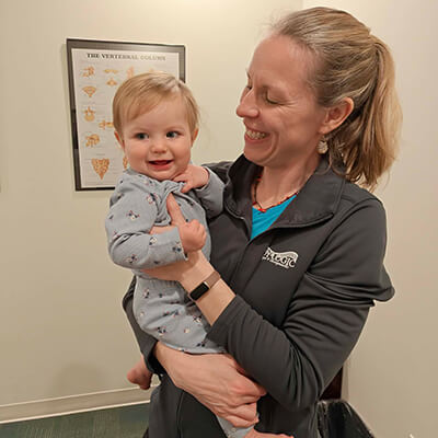 Dr Amanda holding baby girl