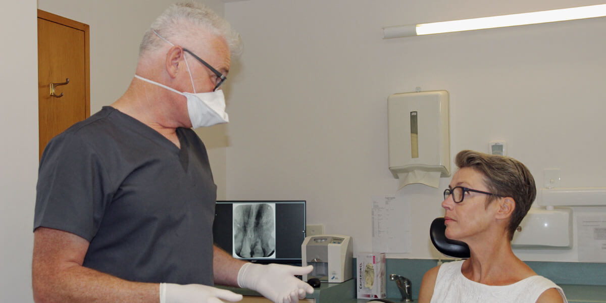 Dr Keith with female patient in chair