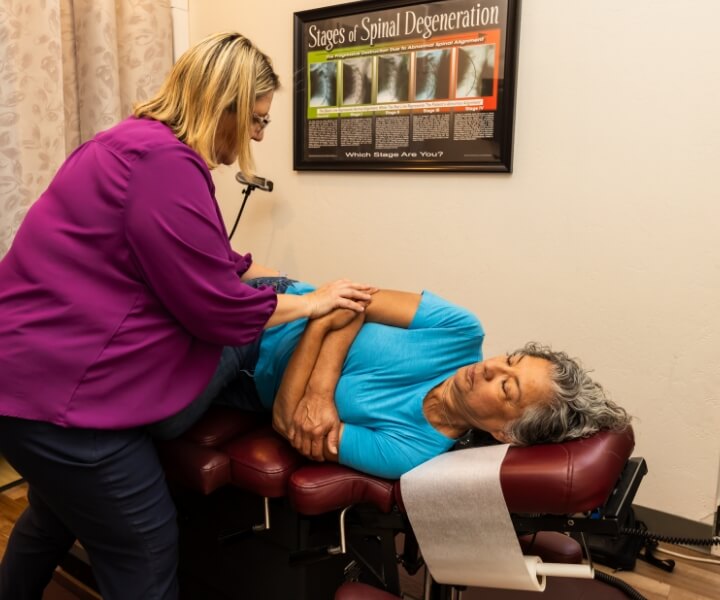 Phoenix chiropractor Dr Carla adjusting patients neck