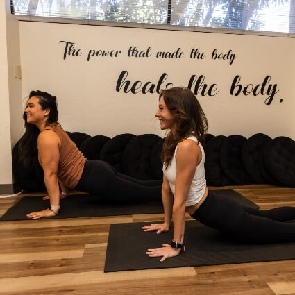 yoga teacher and student