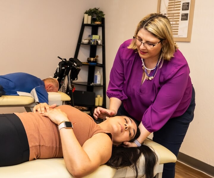 Chiropractor adjusting neck