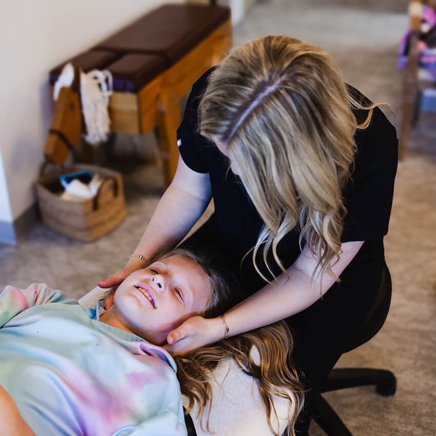 Dr Lily adjusting patients neck