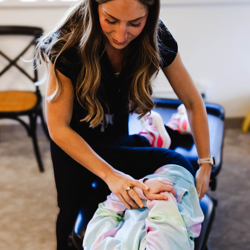Dr Morgan adjusting child patient