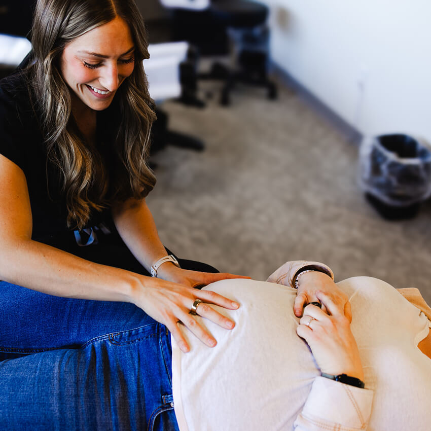 Apple Valley chiropractor Dr Morgan with a pregnant patient