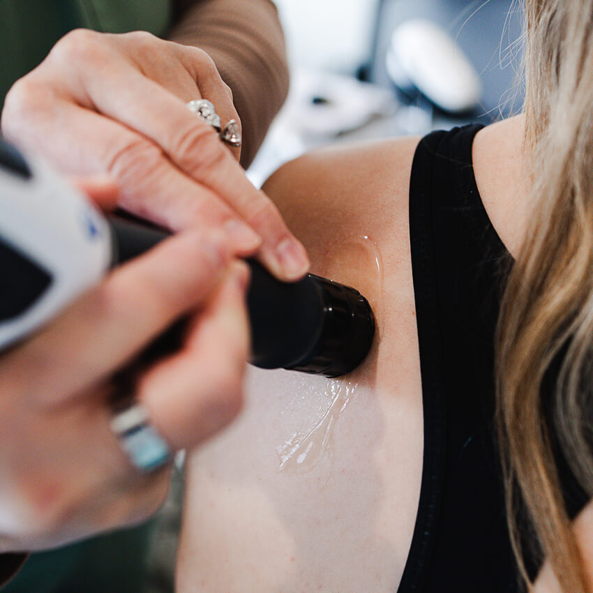 shockwave tool on patients shoulder