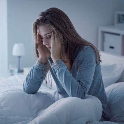 woman-with-insomnia-holding-head-sq (1)