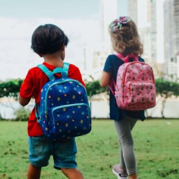 two kids wearing backpacks