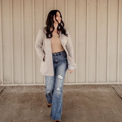 Dr. Cheryl Koelling standing near a wall