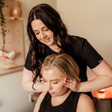 Dr. K adjusting patient's neck