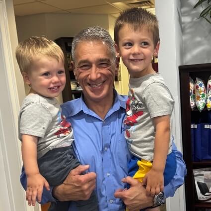 Chiropractor holding kids