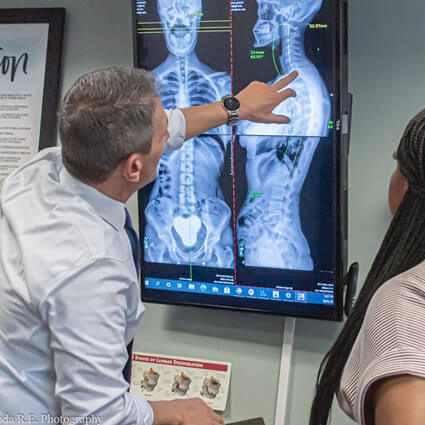 Doctor pointing to xrays