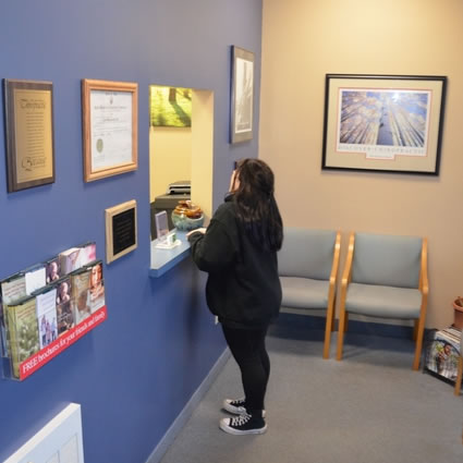 Patient at reception window