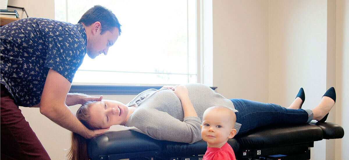 Mom on table with child next to her