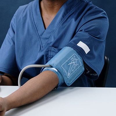 person wearing a blood pressure cuff