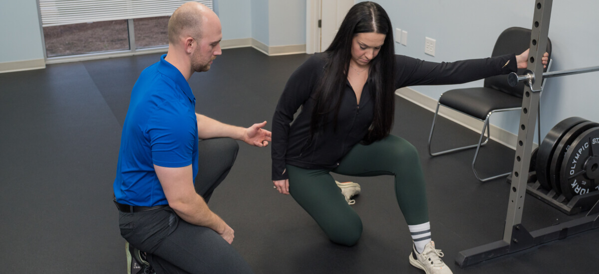 Patient receiving muscle rehab guidance