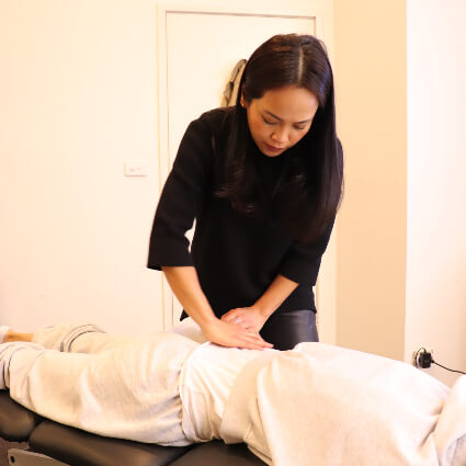 Pressing on lower back