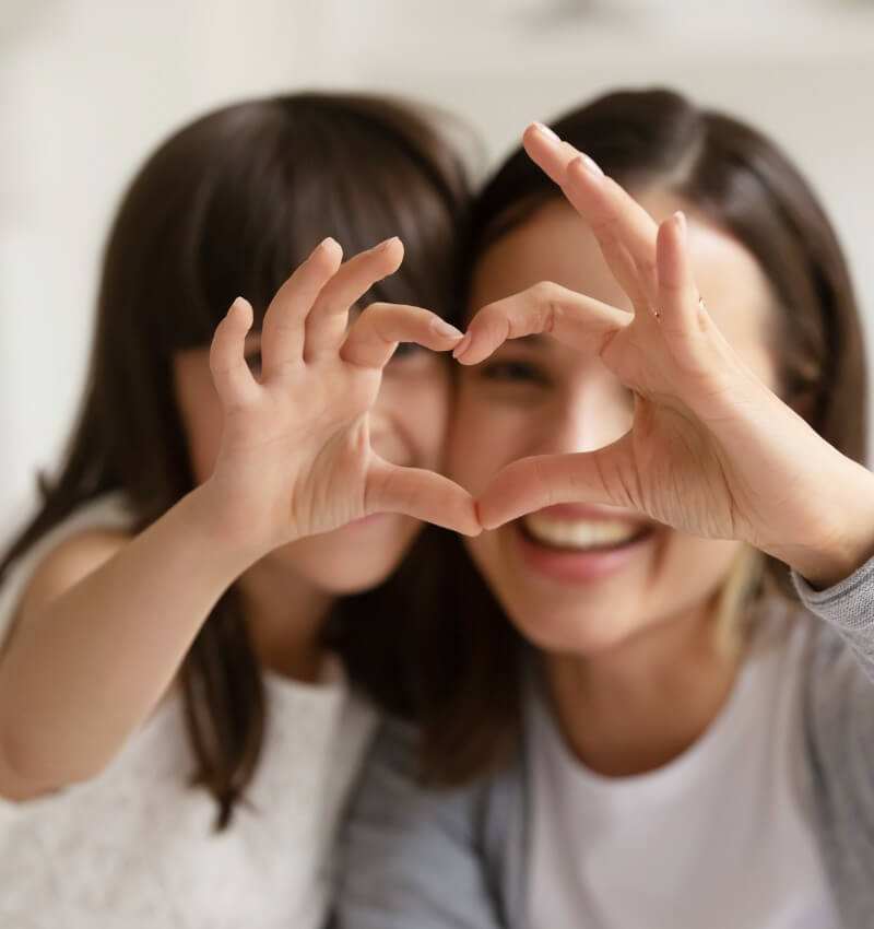 mother and daughter heart sign