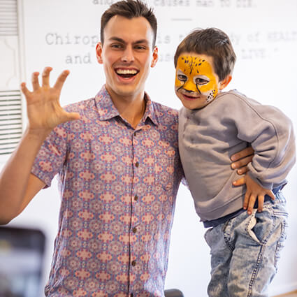 Doctor-with-face-painted-child