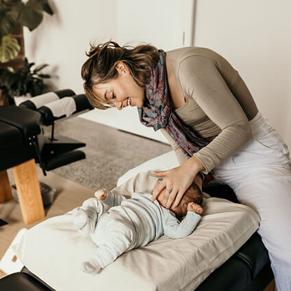 Female-Doctor-Adjusting-Tiny-Baby