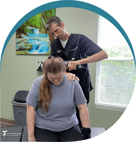 Dr. Richard Blalock adjusting patient'