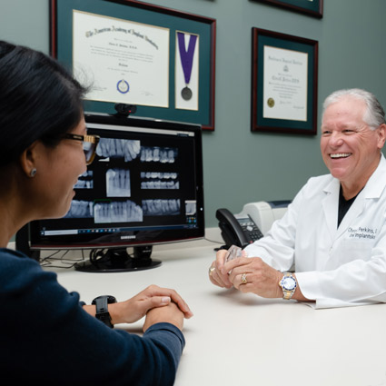 Dr. Perkins smiling at patient