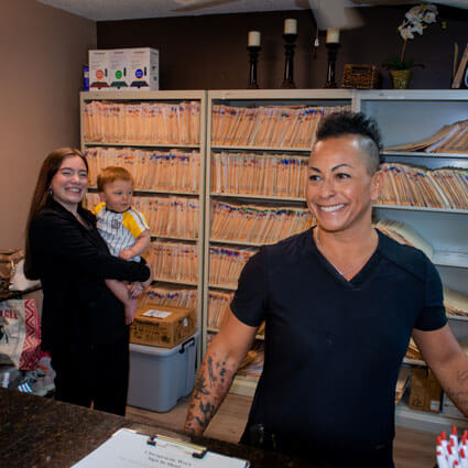 staff at front desk smiling