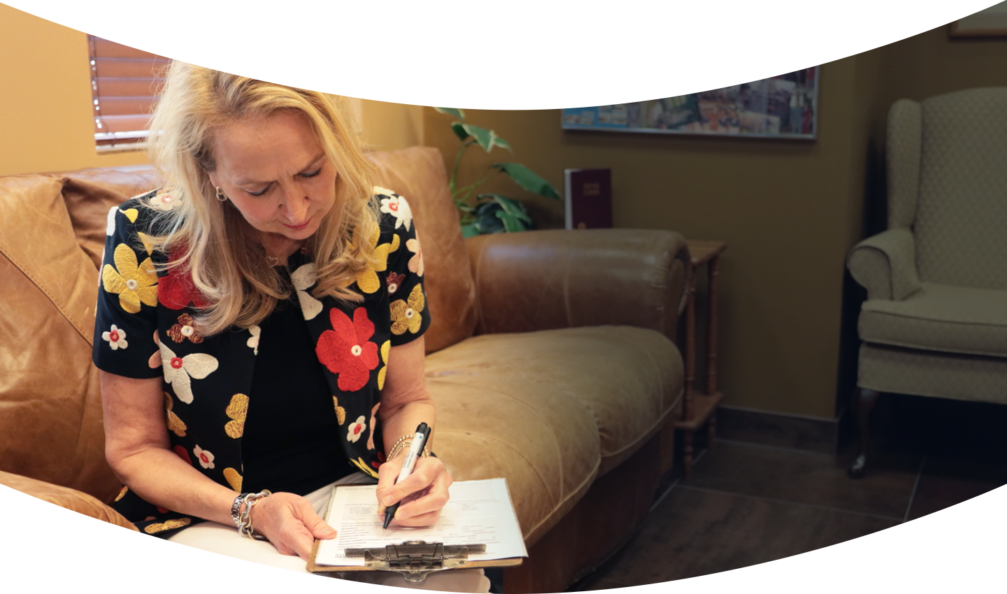 woman filling out paperwork
