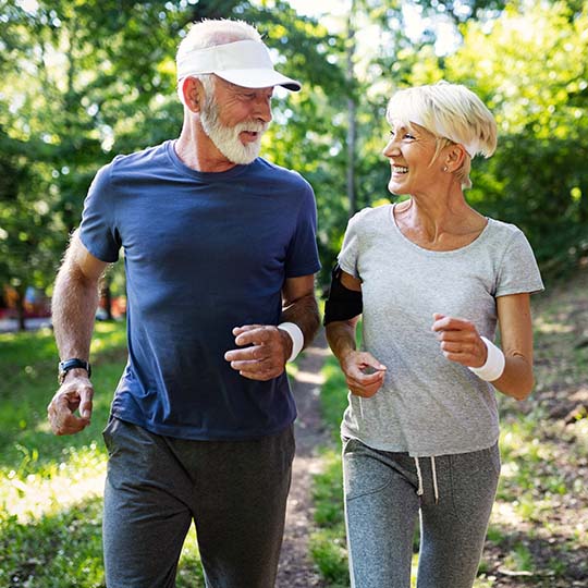 Old couple jogging