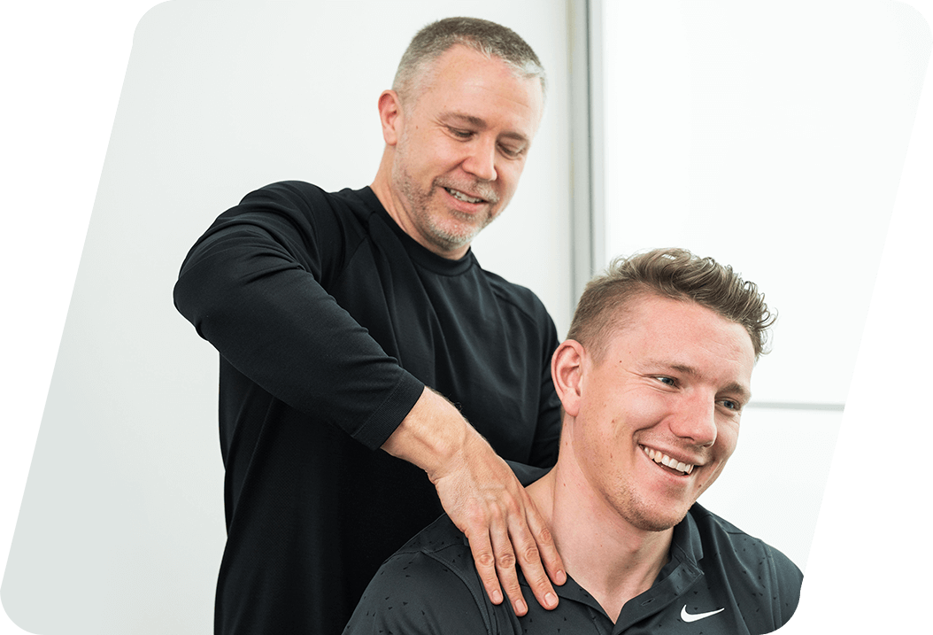 Dr. Dylan pressing on mans neck