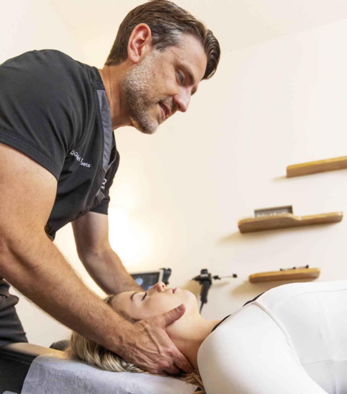 Bartram Park chiropractor Dr Gabriel adjusting patients neck