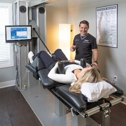 patient talking to Dr Gabriel while on decompression table