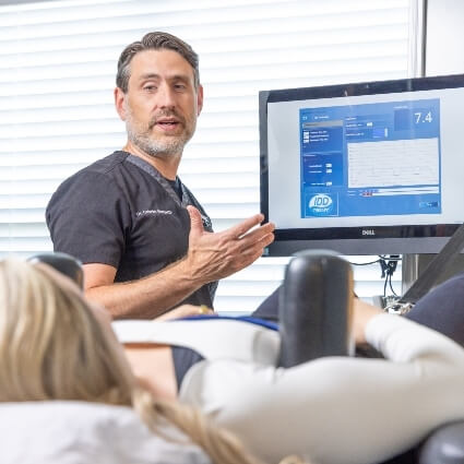Dr Gabriel talking to patient while on decompression table