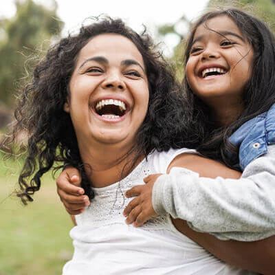 daughter-riding-on-moms-back-sq