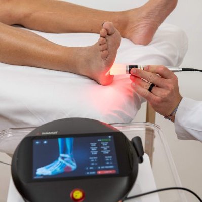 patient having laser treatment on foot