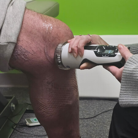 Acoustic Shockwave Therapy treatment applied to Denver patient's knee
