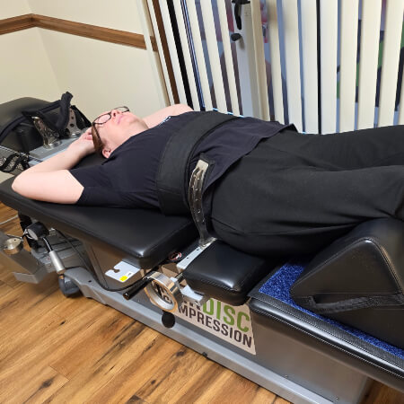Denver on a SpineMED Decompression Therapy table