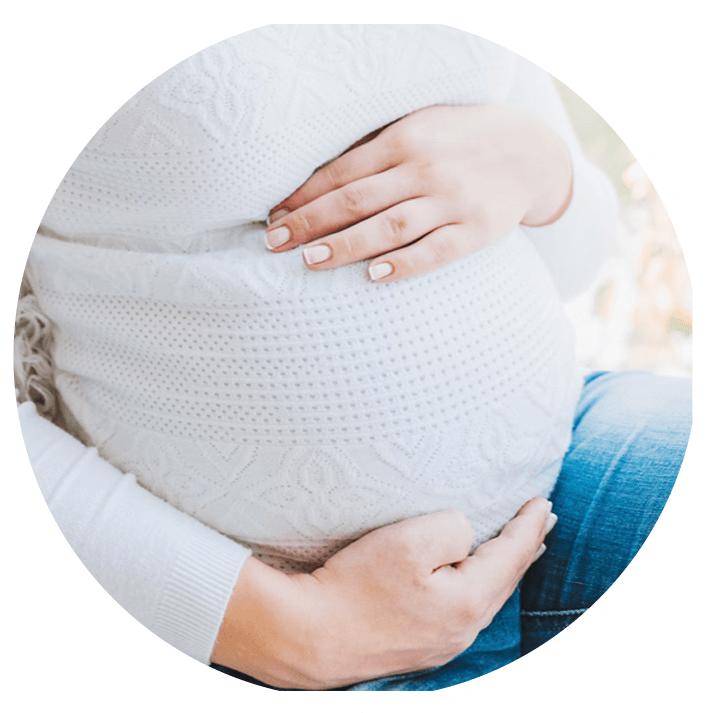 Pregnant woman touching belly
