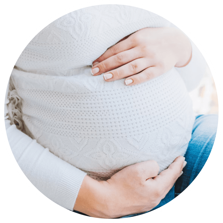 Pregnant woman touching belly