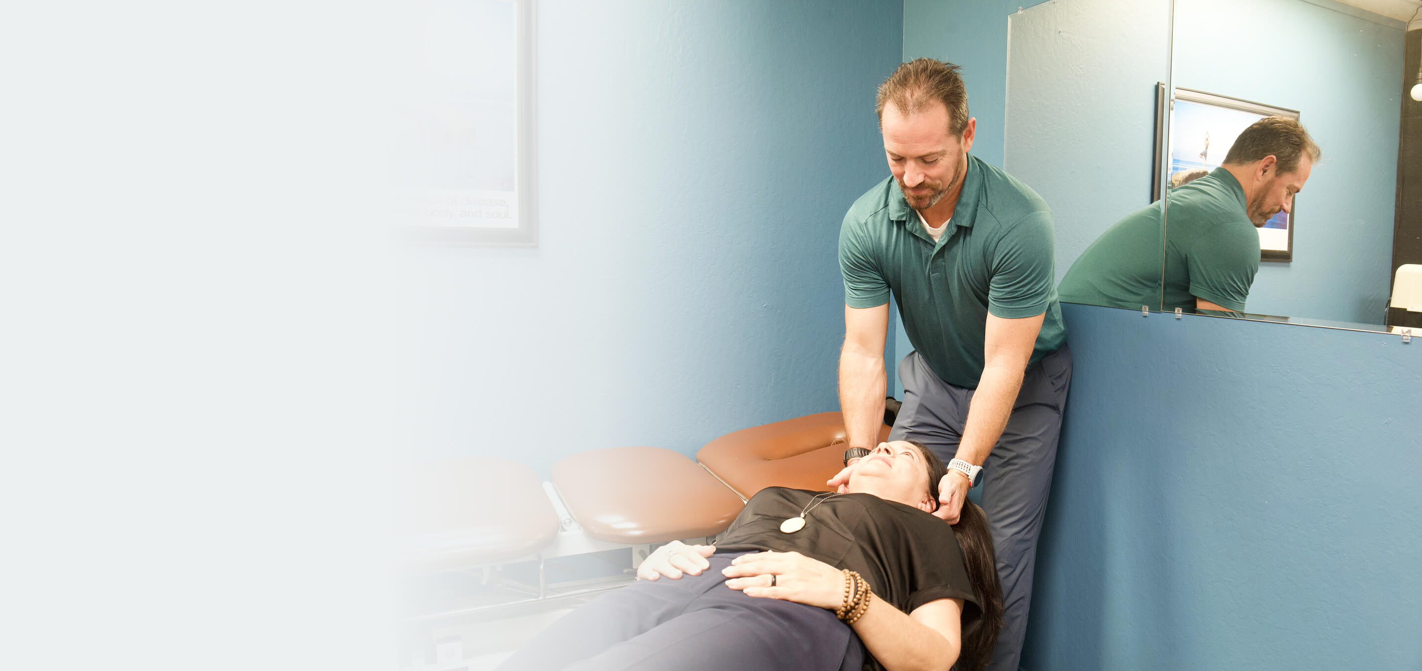 Dr. Callaway gently checking a patient's upper neck