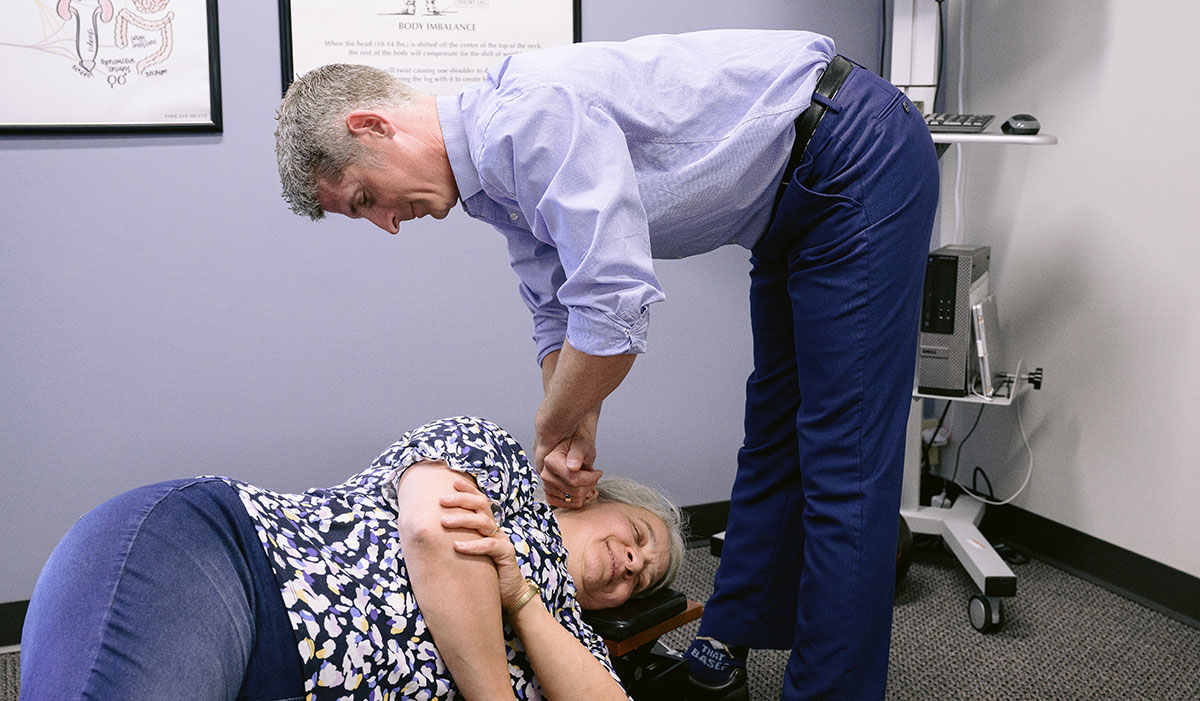 Dr adjusting woman