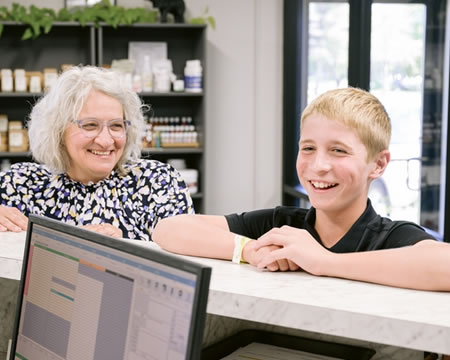 Boy smiling at checkin desk