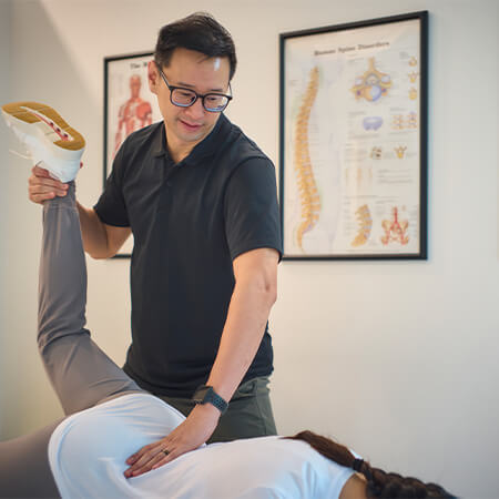 Chiropractor using Active Release Technique on patient