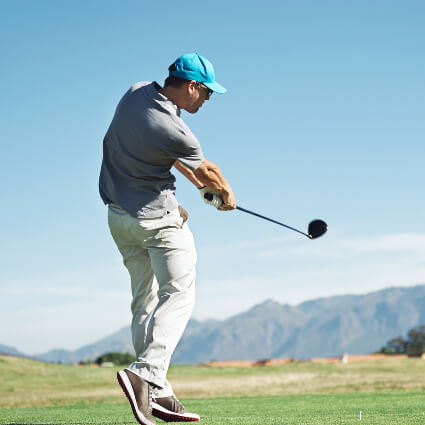 Man swinging golf club