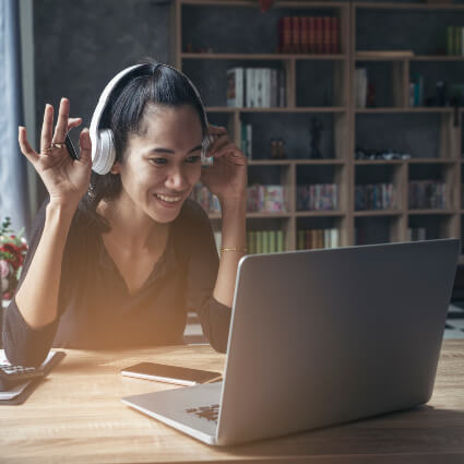 Smiling woman using a laptop