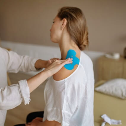 Female patient receiving sports taping