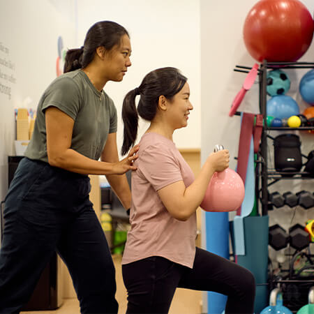 Physiotherapist assisting patient