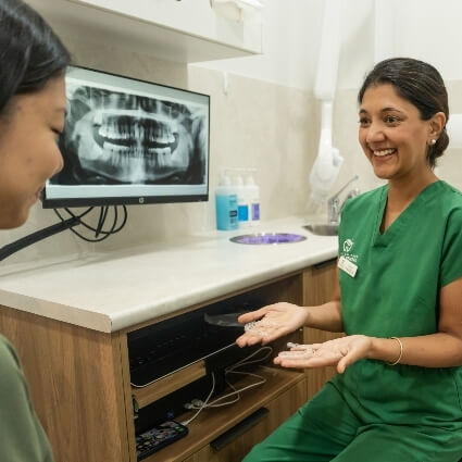 Shenton Park dentist Dr Ash showing patient scans